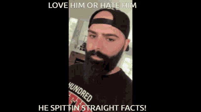 a man with a beard is wearing a hat and a shirt that says ' heavyweight '