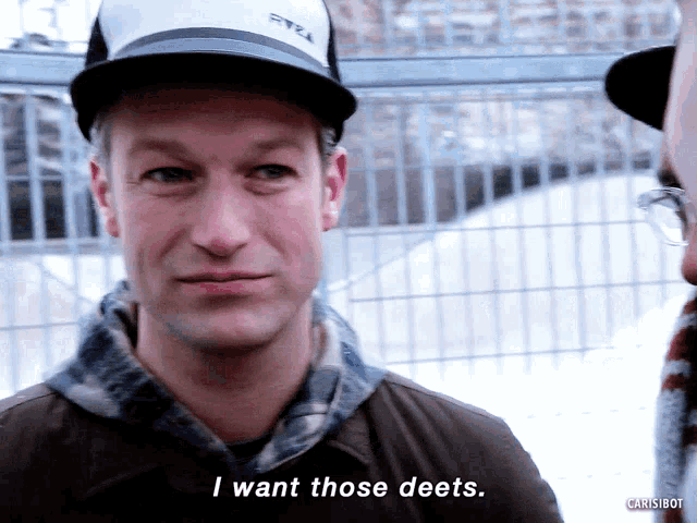 a man wearing a hat that says pyrex on it