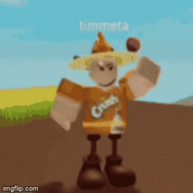 a cartoon character with a crown on his head is holding an apple .