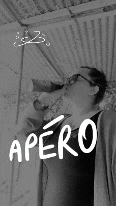 a black and white photo of a woman drinking from a bottle with the word apero written on it