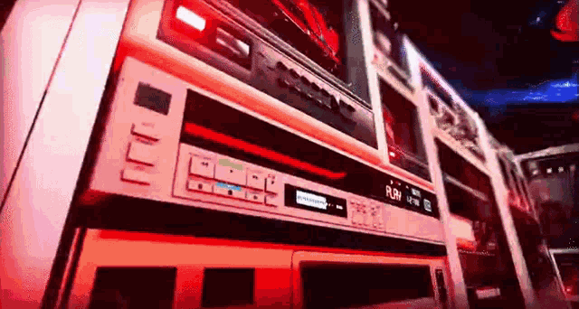 a bunch of old cassette tapes are stacked on top of each other on a wall .