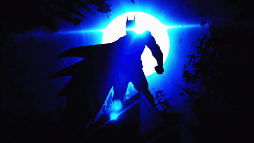 a silhouette of batman against a blue background