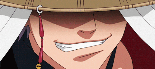 a close up of a man wearing a hat with a c on it