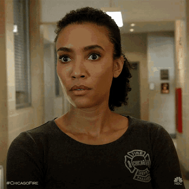 a woman in a chicago fire department shirt