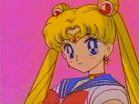 sailor moon is giving a high five to someone .