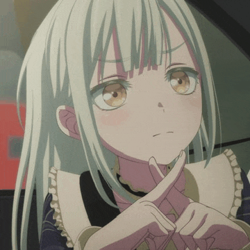 a girl with white hair and brown eyes is making a cross with her hands