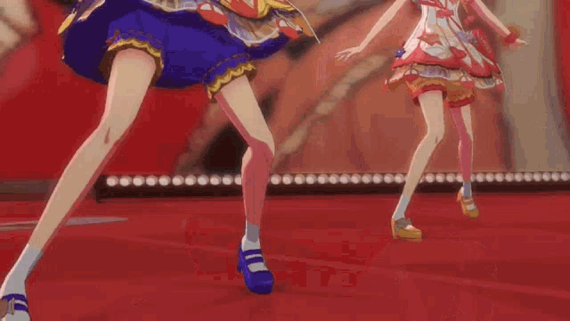 two anime girls are dancing on a red carpet in front of a crowd