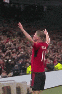 a man in a red jersey with the number 11 on the back