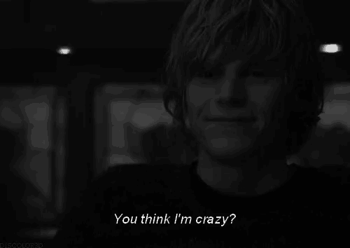 a man with a skull painted on his face and the words `` you think i 'm crazy '' below him .