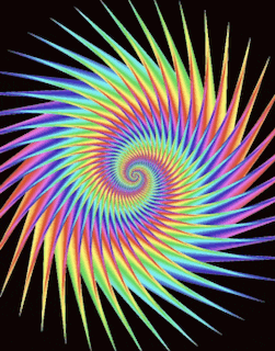 a colorful swirl on a black background that looks like a rainbow