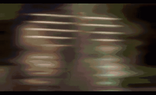 a blurry picture of a person 's face and a blurred background