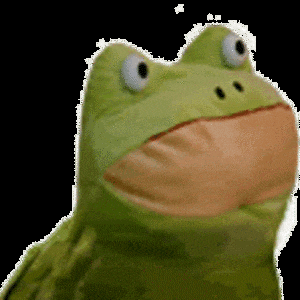 a green stuffed frog with white eyes and an orange beak
