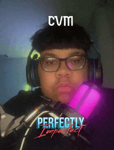 a man wearing headphones and a pink microphone with the words perfectly imperfect behind him