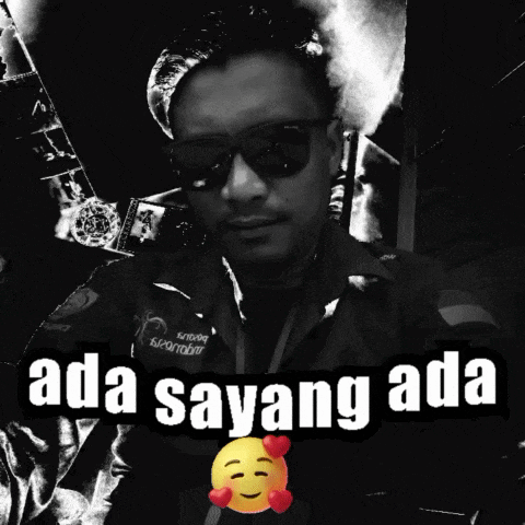 a black and white photo of a man wearing sunglasses with the words ada sayang ada above him