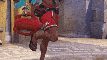 a man wearing red shorts that say " malibu " on them