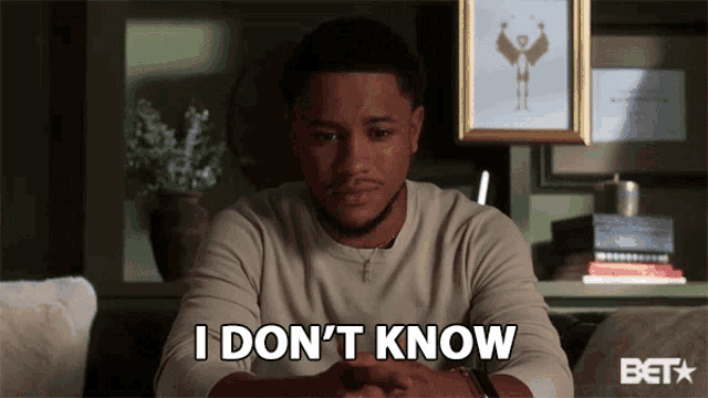 a man is sitting on a couch and says i don 't know