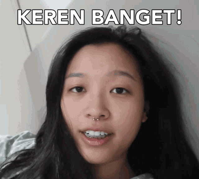 a woman with braces on her teeth and the words keren banget written above her