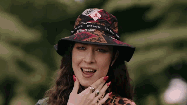a woman wearing a hat that says iam path on it