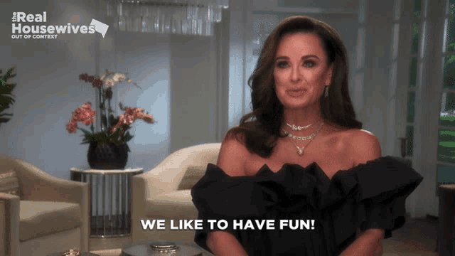 a woman says we like to have fun in front of a real housewives ad
