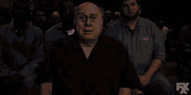 a pixel art of a man with a sign that says john in front of him