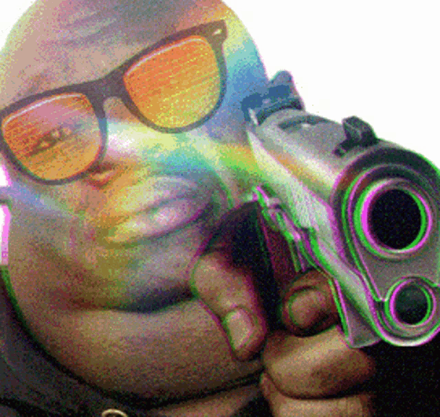 a man wearing sunglasses is holding a gun