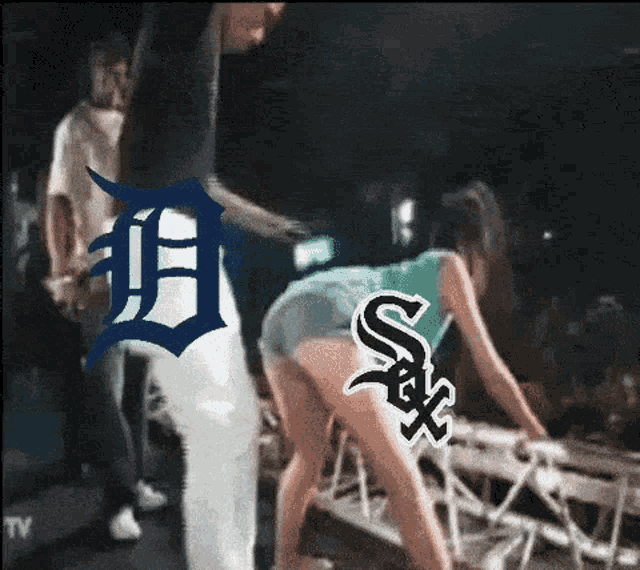 a man and a woman are dancing on a stage with the letters d and s on it