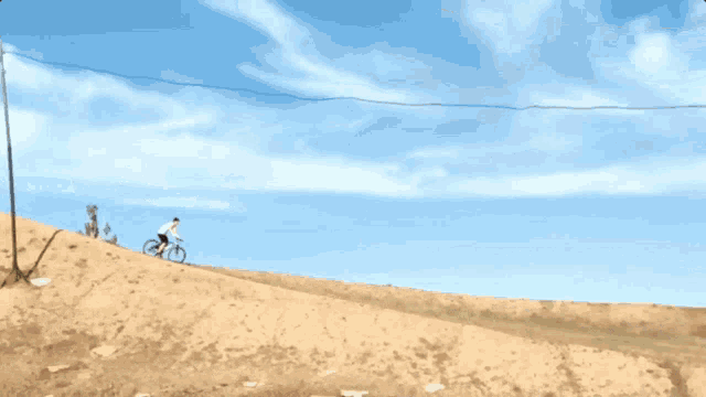 a person is riding a bike down a hill