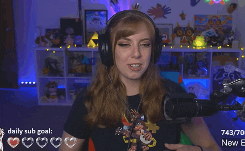 a woman wearing headphones stands in front of a microphone with a daily sub goal of 743/70