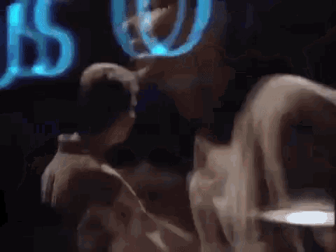 a blurred image of a person standing in front of a sign that says bs