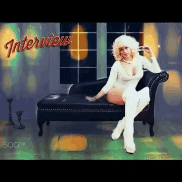 a woman is sitting on a couch with the word interview in red