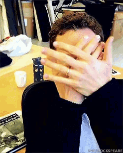 a man covering his face with his hands with the words sherlockspeare on the bottom right