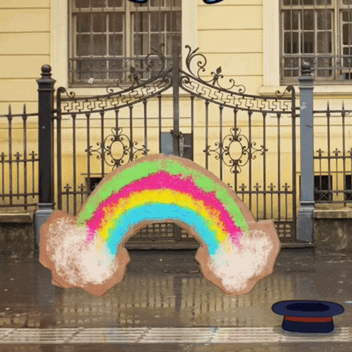 a drawing of a rainbow in front of a gate