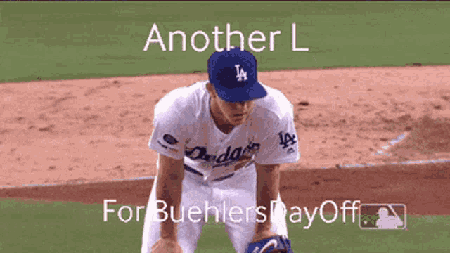 a dodgers player is kneeling on the field