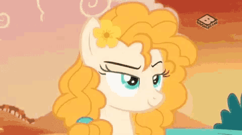 a cartoon pony with a yellow flower in her hair is making a face .