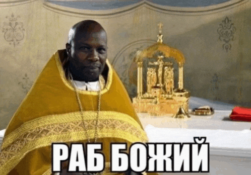 a man in a yellow robe is sitting in front of a table with a cross in the background and the word rab written in black letters