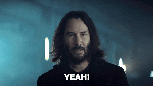 a man with long hair and a beard says the word yeah