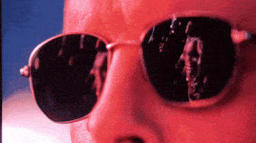 a close up of a person wearing sunglasses