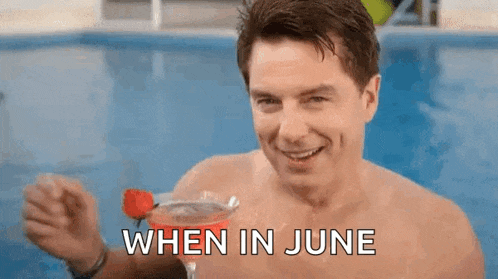 a shirtless man is holding a martini in a swimming pool and says when in june .