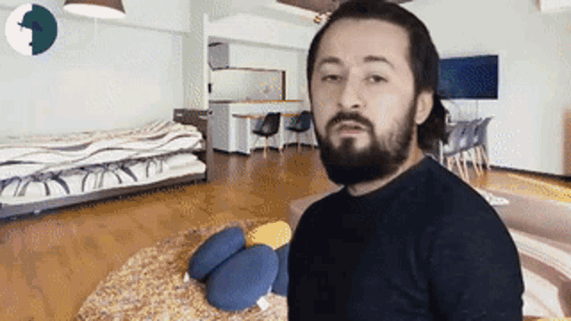 a man with a beard in a living room