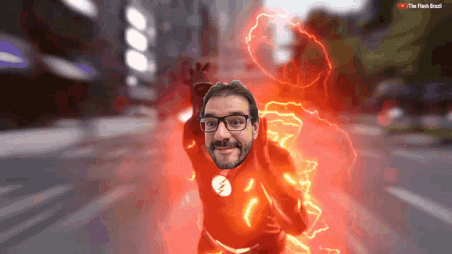 a man in a flash costume is flying through the air with a youtube logo in the background