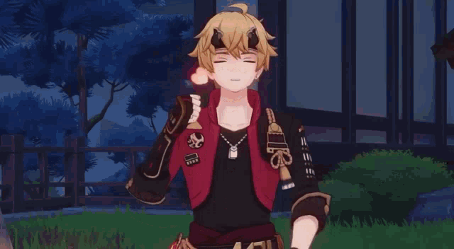 a boy with horns on his head is wearing a red jacket and a black shirt