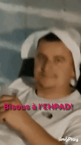 a man with a towel around his head says bisous a l' ehrpad !