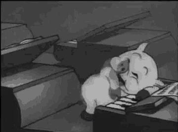 a cartoon pig is playing a piano in a black and white cartoon .
