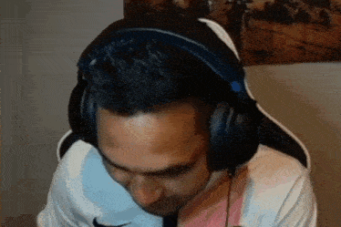 a man wearing headphones is sitting in a chair
