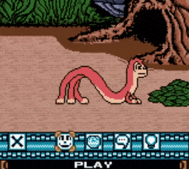 a video game screen shows a snake and the words play at the bottom