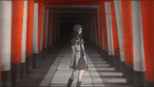 a girl standing in a hallway with red and white striped walls