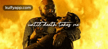 a man is holding another man in his arms with the words " until death takes me " above them