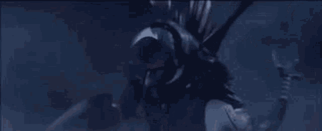 a close up of a person 's face in a dark room in a movie .