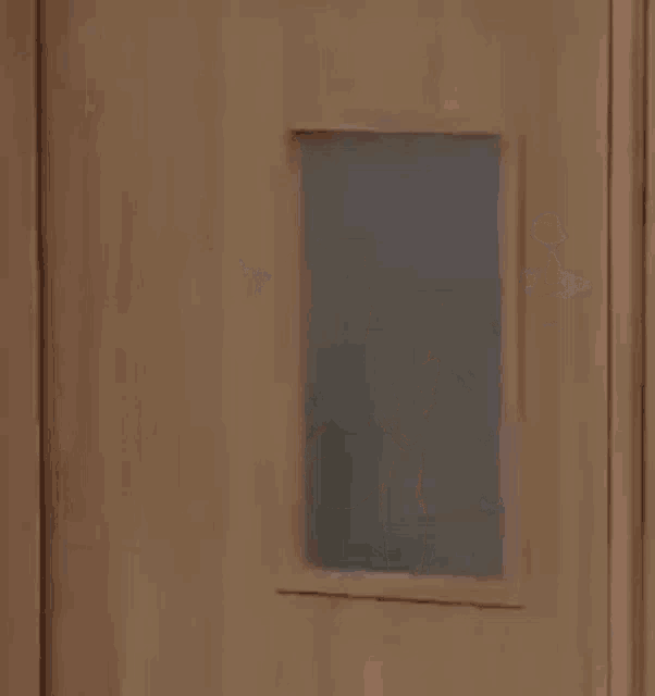 a group of girls in school uniforms are standing next to each other in a doorway .