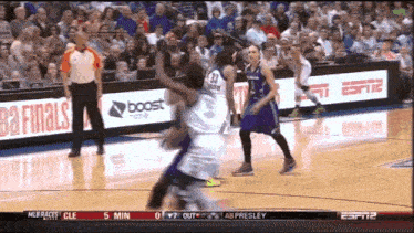a basketball game is being played in front of a crowd and the score is 0 to 7